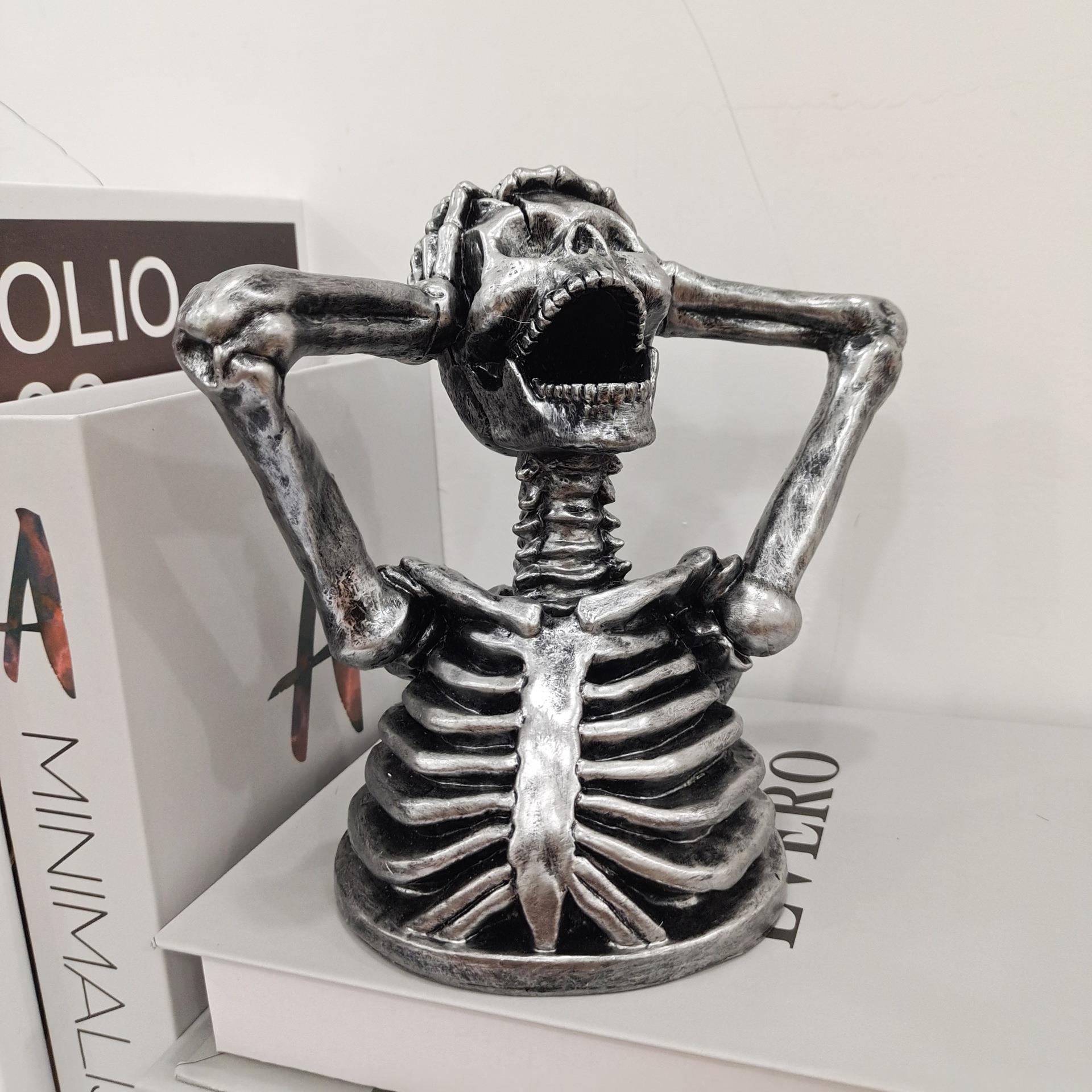 Sculpture Breaks Down Madness Skeleton Bust