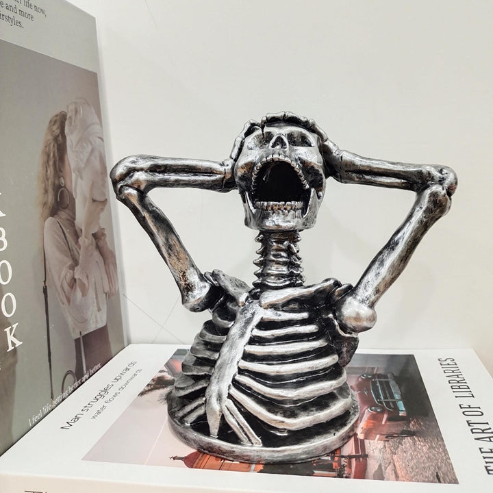 Sculpture Breaks Down Madness Skeleton Bust